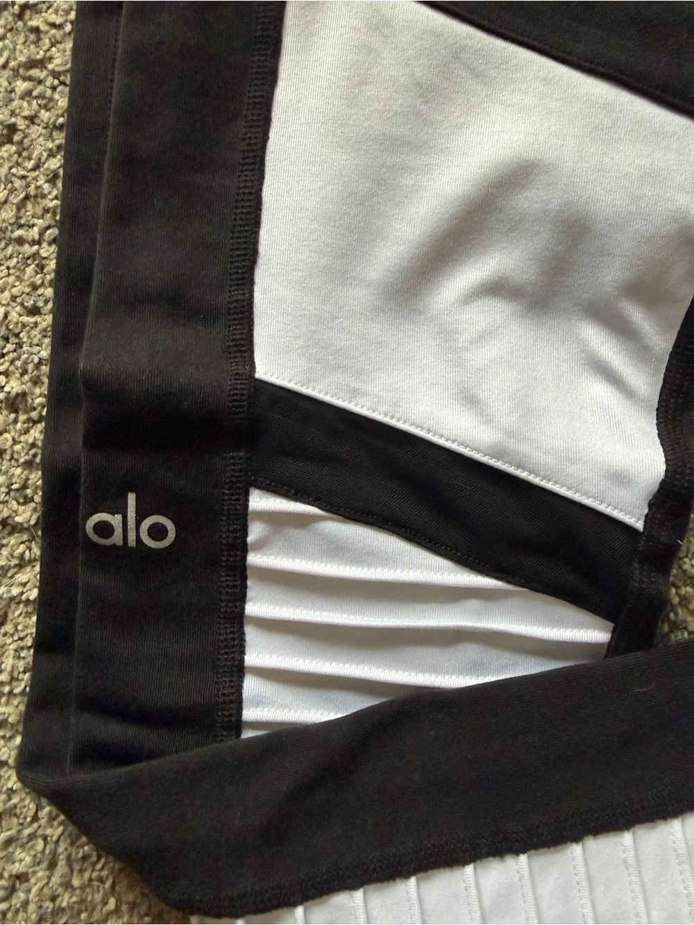 ALO Yoga Moto Leggings in a black and white